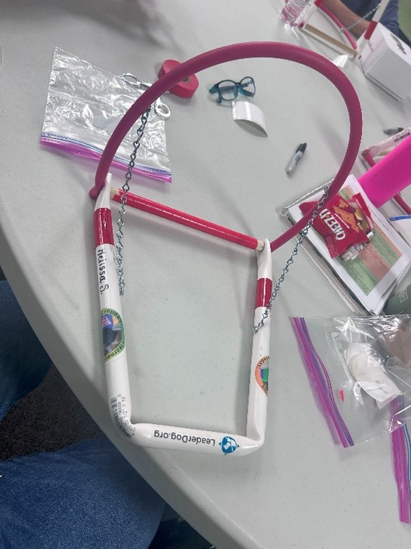 The Juno Melissa made during a make and take session. It is a harness to be used with a human to simulate a dog guide experience.